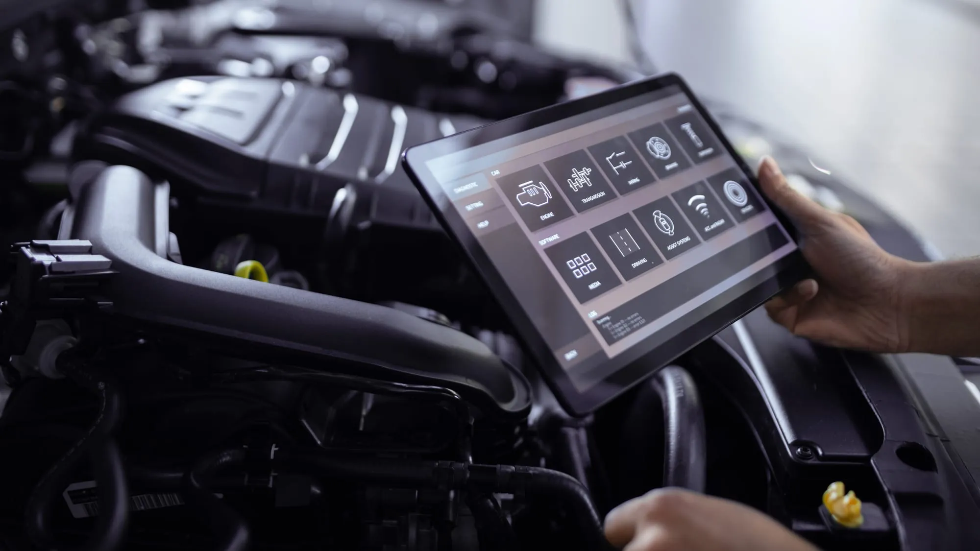 Mechanic managing jobs on a tablet